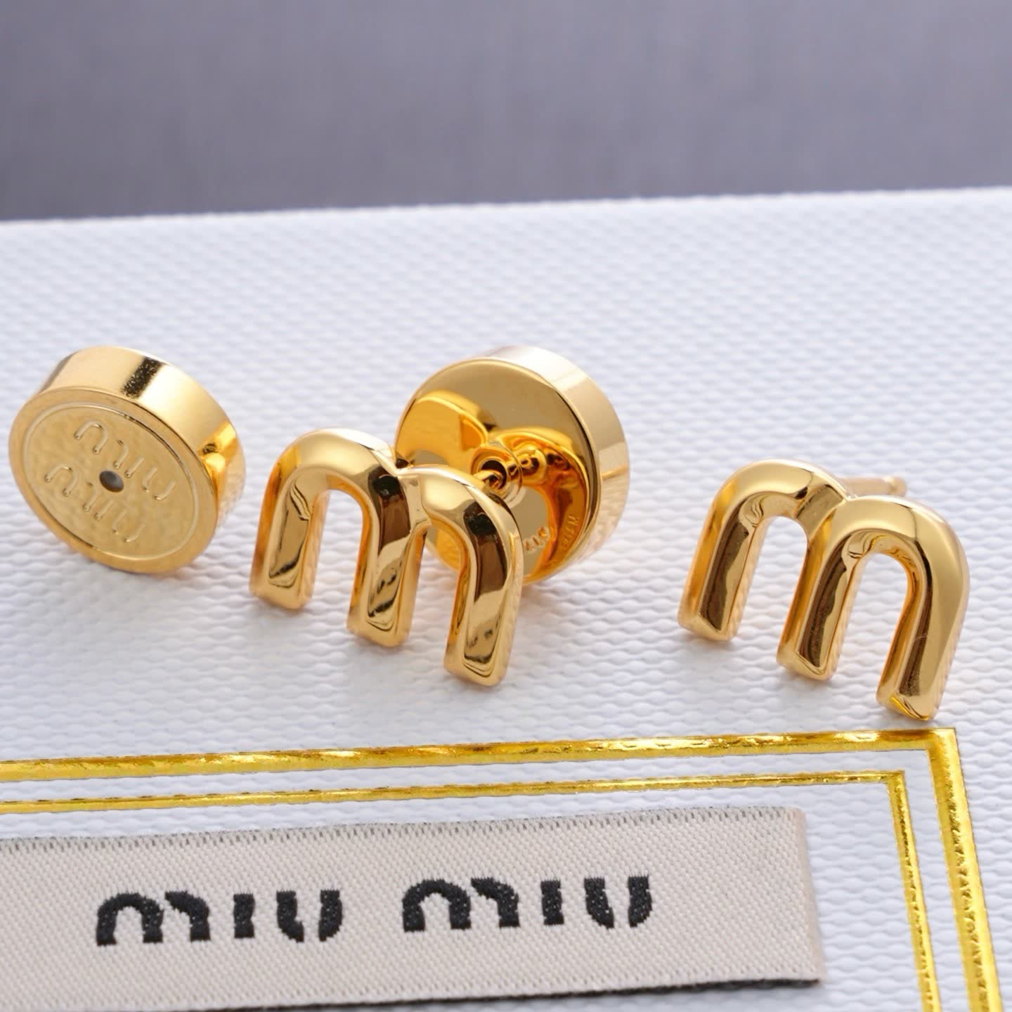 Miu Miu Gold Tone 'M' Stud Earrings